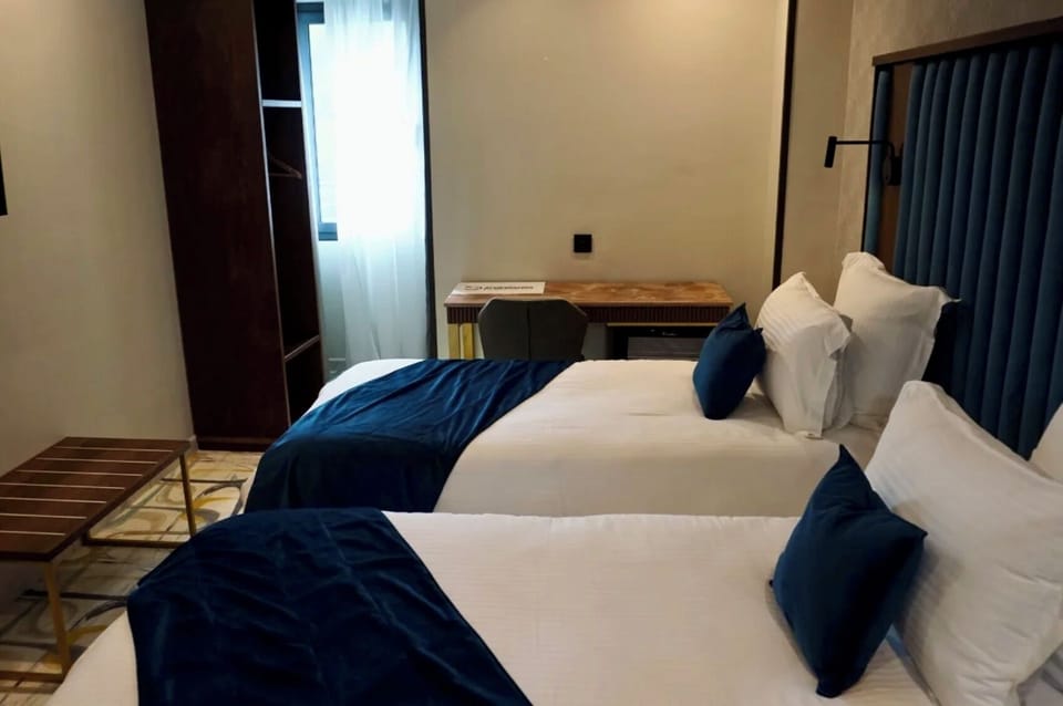 Standard Double or Twin Room | Minibar, in-room safe, desk, laptop workspace