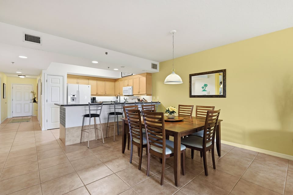 Gather around your spacious dining table while breakfast simmers in the fully-equipped kitchen, creating warm memories in this bright, welcoming home away from home.