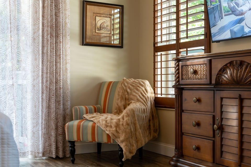The master suite includes a cozy sitting area—perfect for reading, relaxing, or enjoying your morning coffee.