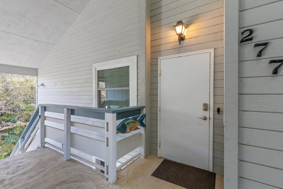 Arrive in style at this charming coastal vacation rental featuring a private entrance and breezy balcony access. The perfect start to your relaxing beach stay getaway near sun, sand, and surf.