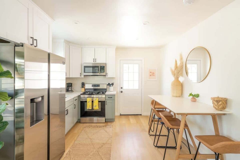 Eat together at the stylish dining table with seating for four