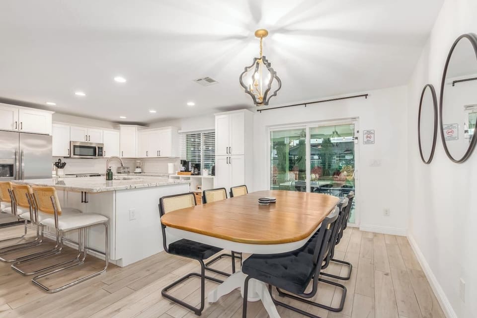 Large dining table with seating for group meals and game nights.