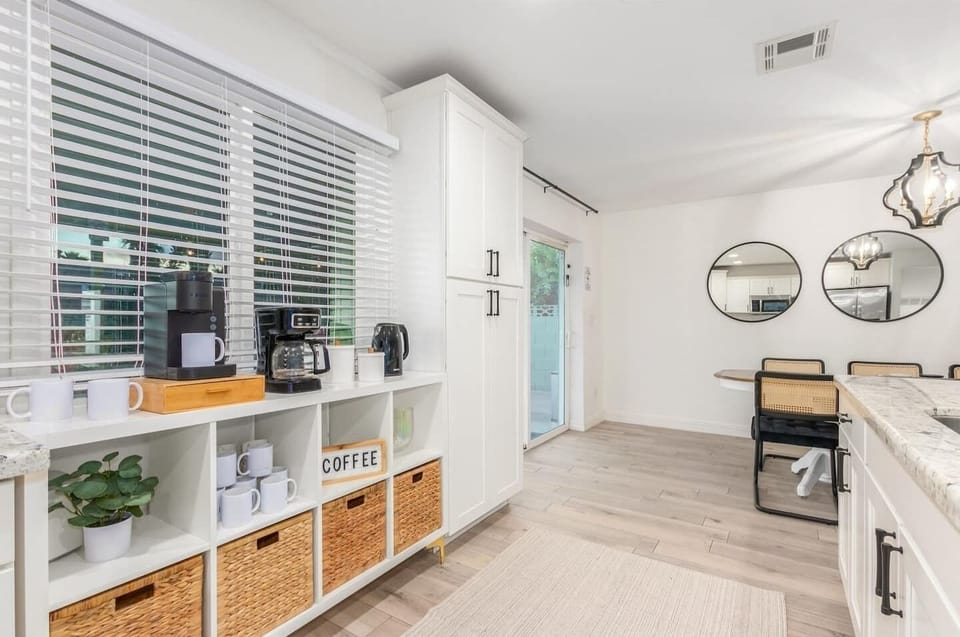 Bright kitchen with ample storage, coffee station, and easy access to the main living areas.