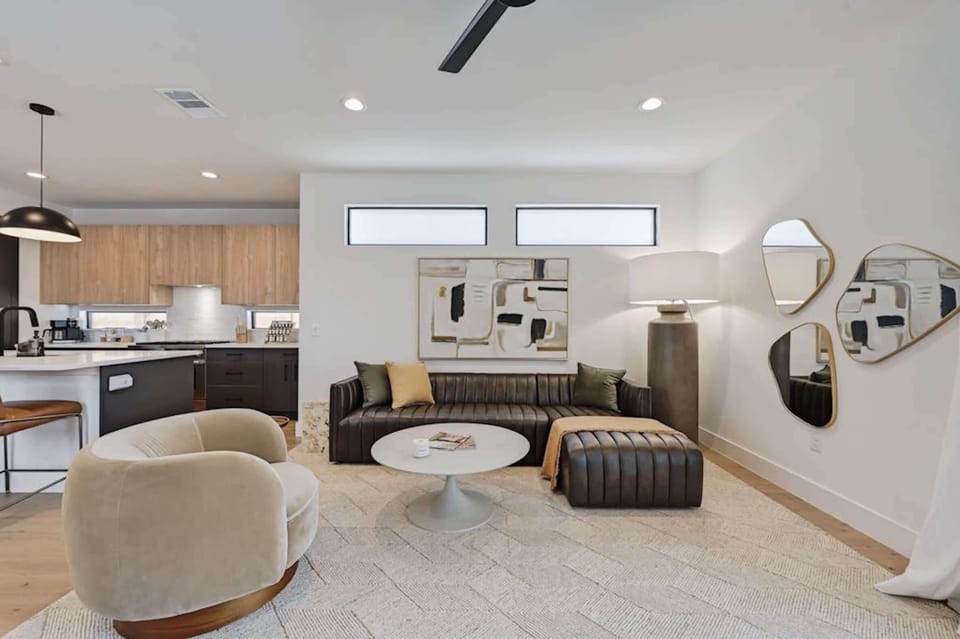 Open-concept living room w/a smart TV and patio access