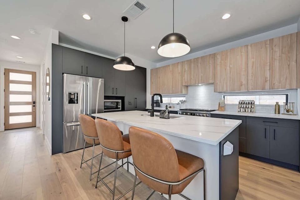 Modern, fully equipped kitchen w/a Keurig, pantry, & island seating for 3