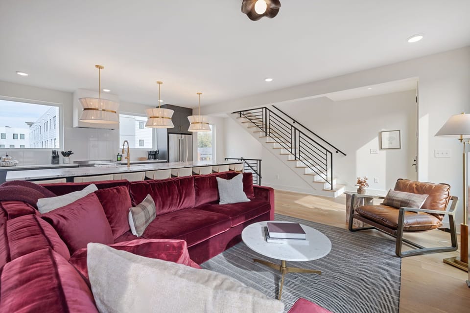 The Chestnut – Spacious living room with open staircase