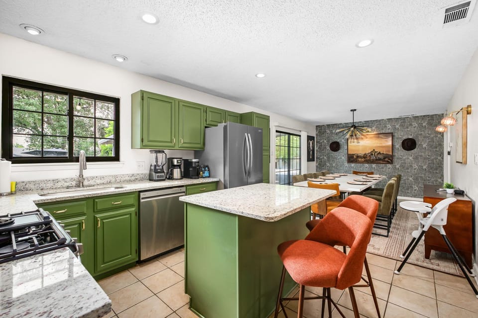 Flowing seamlessly from the kitchen, the dining area provides a stylish and inviting space to enjoy every meal.