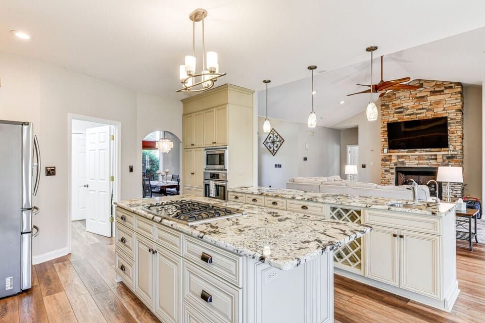 Modern Kitchen | Large Granite Island | Pendant Lighting | Open Floor Plan |