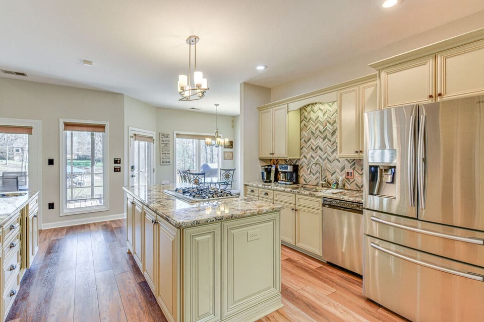 Modern Kitchen | Large Granite Island | Pendant Lighting | Open Floor Plan |