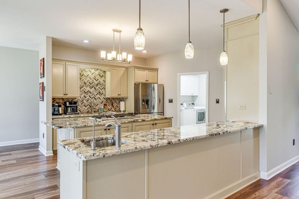 Modern Kitchen | Large Granite Island | Pendant Lighting | Open Floor Plan |