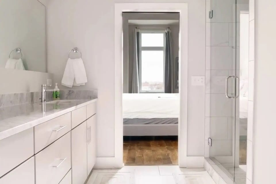 Ensuite bathroom attached to third-floor primary bedroom with walk-in shower