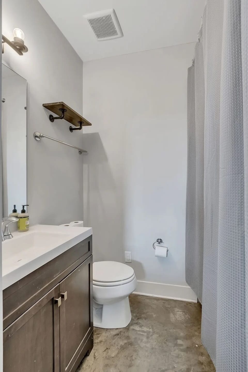 Ensuite bathroom attached to first-floor Bedroom 1 with tub/shower combo