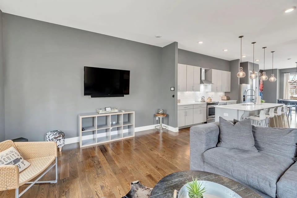 Second-floor living room open to kitchen and dining area