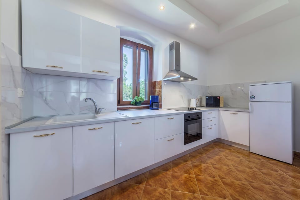 Villa | Private kitchen | Fridge, microwave, oven, stovetop