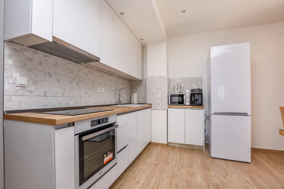 Villa | Private kitchen | Fridge, microwave, oven, stovetop