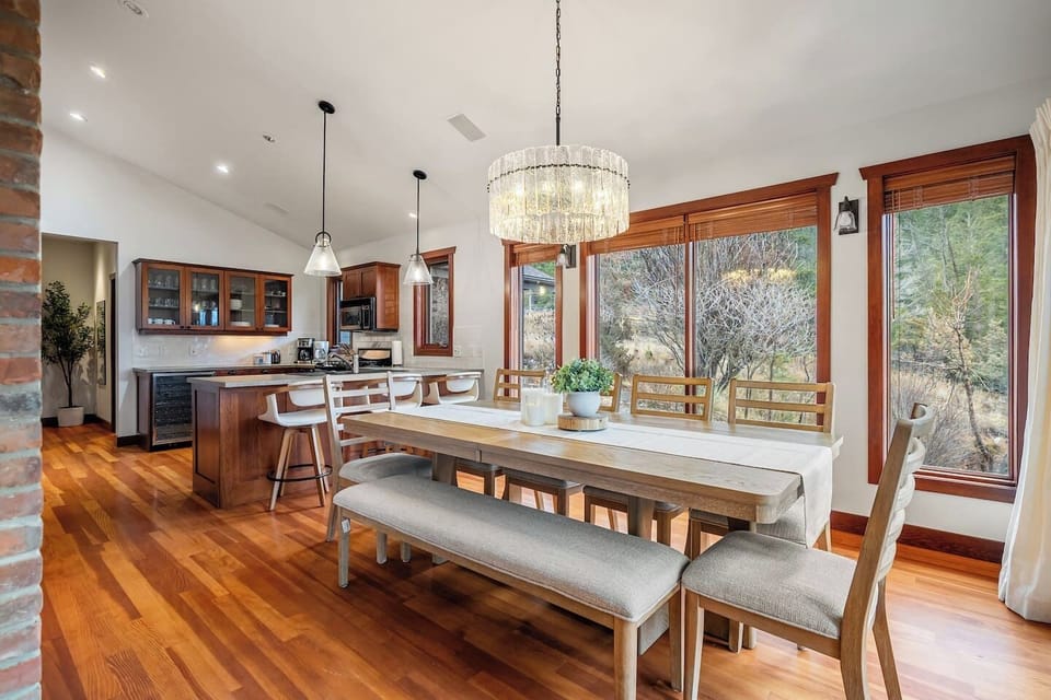 Dining area with seating for 8 at the table and 3 at the island.