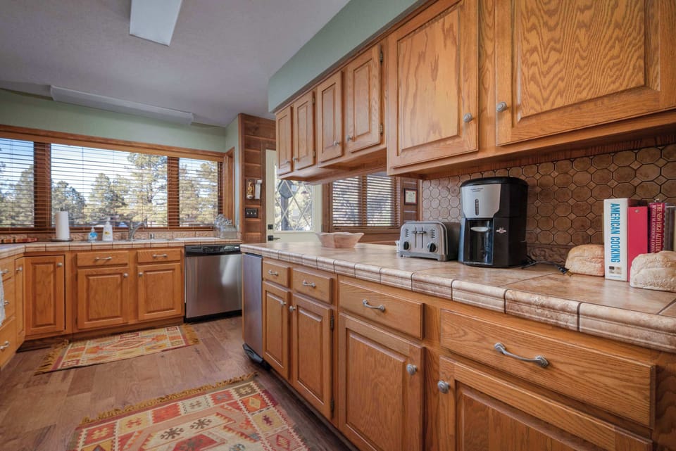 Fully equipped and ready for your culinary adventures, this kitchen is perfect for whipping up breakfast, experimenting with new recipes, or enjoying a casual coffee with a view.
