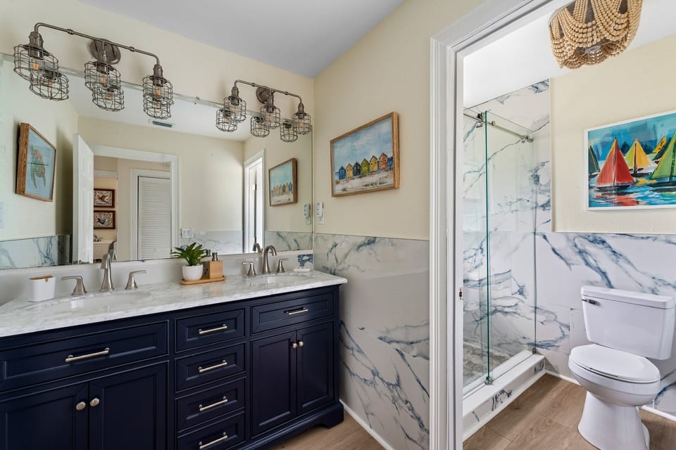 Sereneguest bath with large walk-in shower, double vanity and gorgeous tile