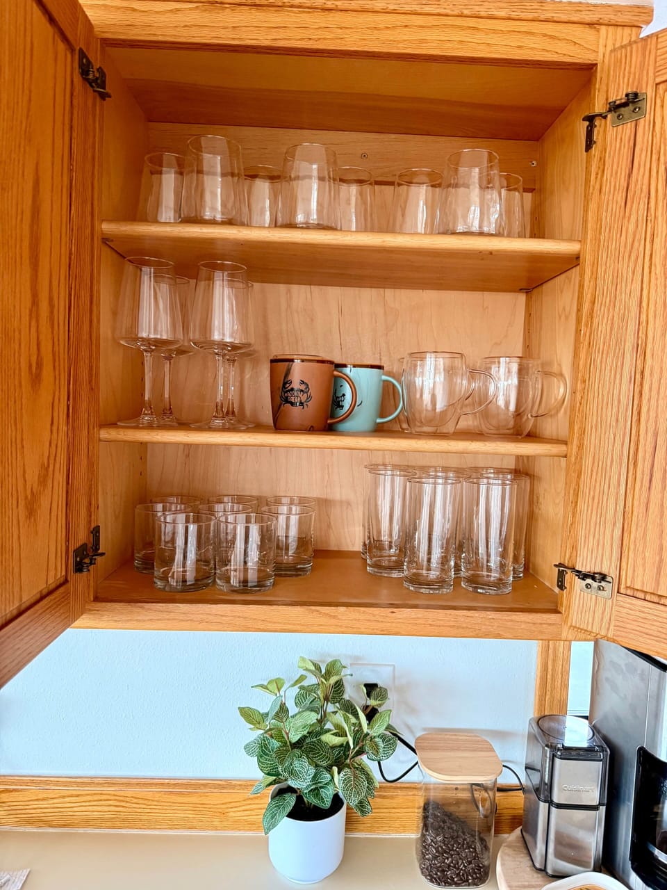 wine glasses and fully stocked kitchen