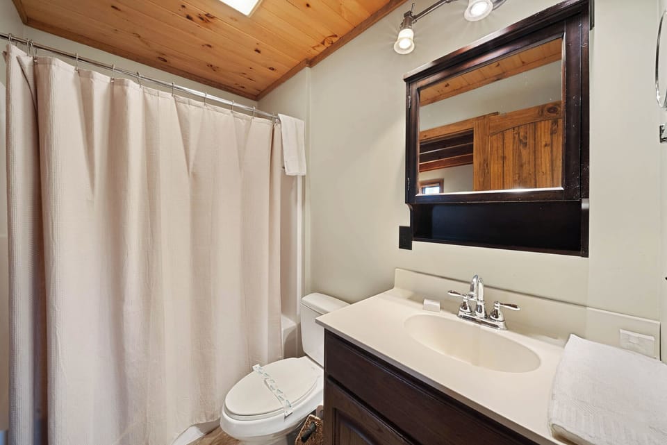 Main Floor Bathroom with Access from the Master Bedroom and Hall