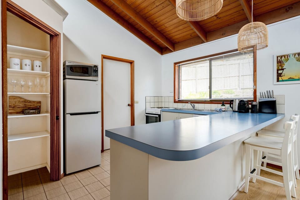 Spacious kitchen with breakfast bar and ample prep space