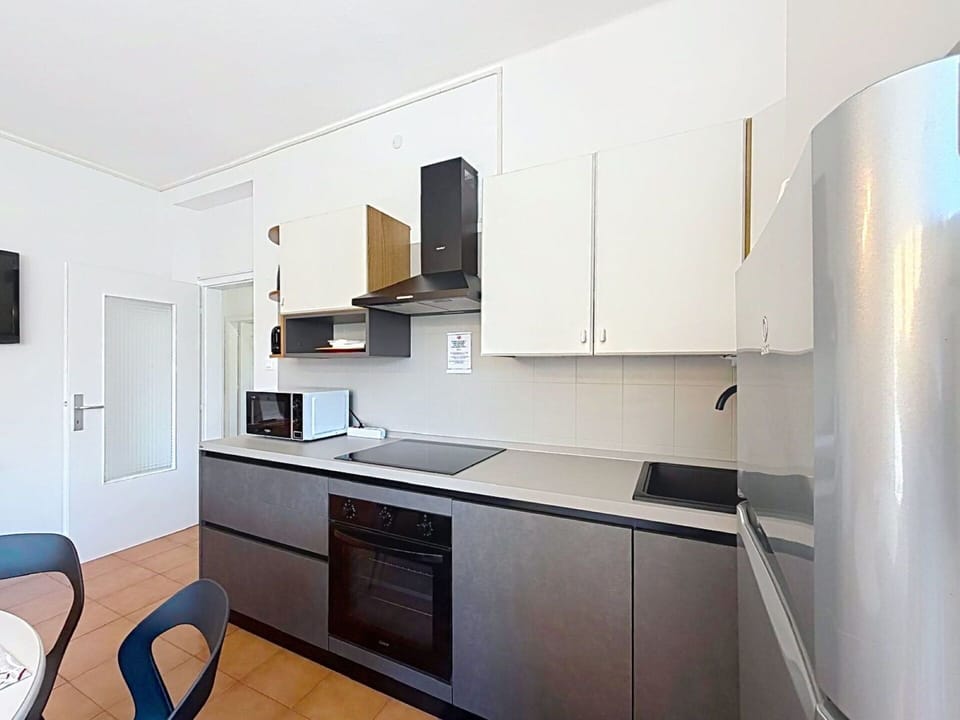 Kitchen, Kitchen Appliance, Countertop, Major Appliance, Cabinetry, Interior Design, Flooring, Kitchen Stove, Home Appliance, Furniture