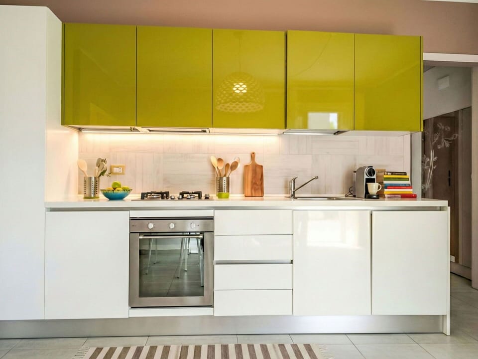 Kitchen, Kitchen Appliance, Countertop, Cabinetry, Interior Design, Major Appliance, Furniture, Yellow, Flooring, Cupboard