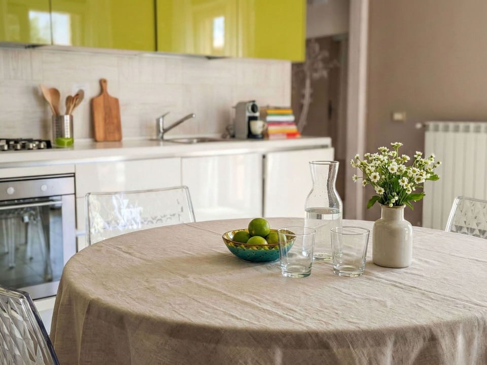 Furniture, Interior Design, Table, Flooring, Kitchen & Dining Room Table, Wood, Dining Room, Tableware, Tablecloth, Chair