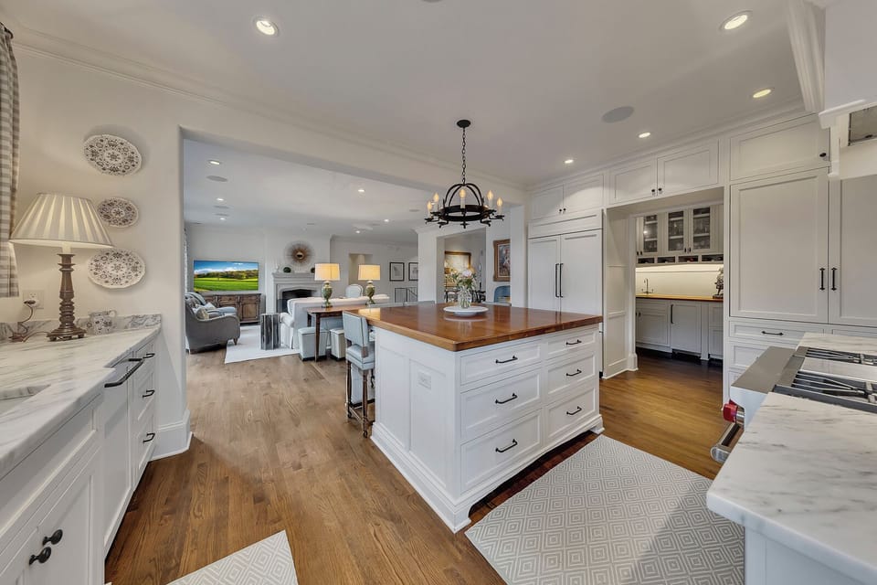 Open kitchen w/ large island & seamless flow into the living space
