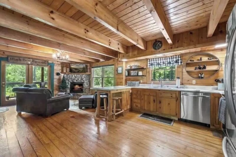 Open-concept layout connecting living, dining, and kitchen.

