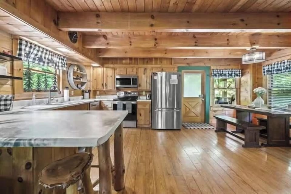 Fully equipped kitchen with stainless appliances and ample counter space.
