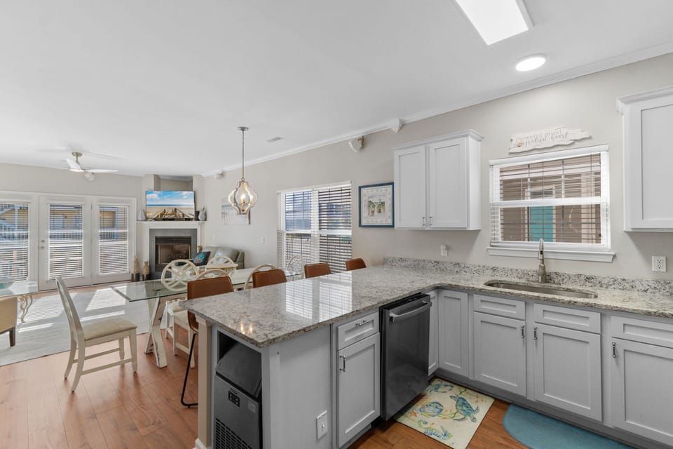 Your spacious kitchen features granite countertops and flows seamlessly into the bright dining area, perfect for memorable meals together.