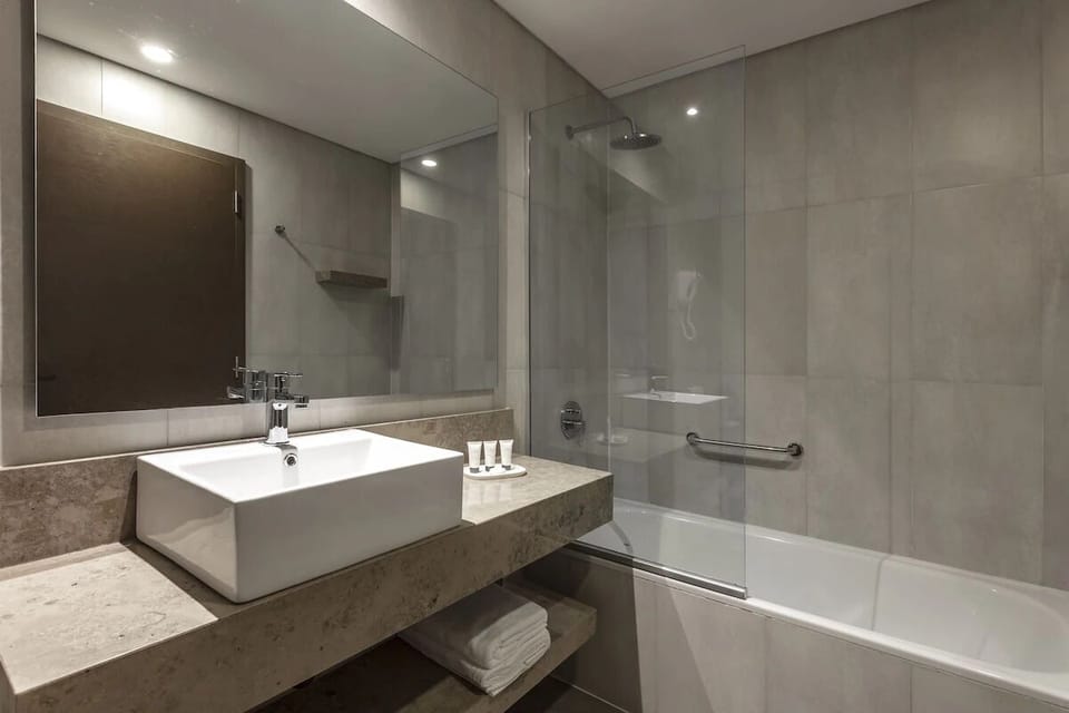 Refresh with a hot shower and sleek vanity amenities.