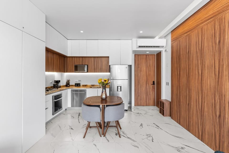Your modern kitchen blends warm wood tones with sleek white cabinetry, creating an inviting space for cooking and dining together.