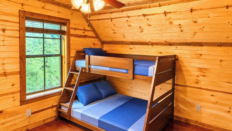 The second bedroom offers a comfortable and quiet place to recharge with 2 twins and 2 doubles, with a layout designed for rest and relaxation.