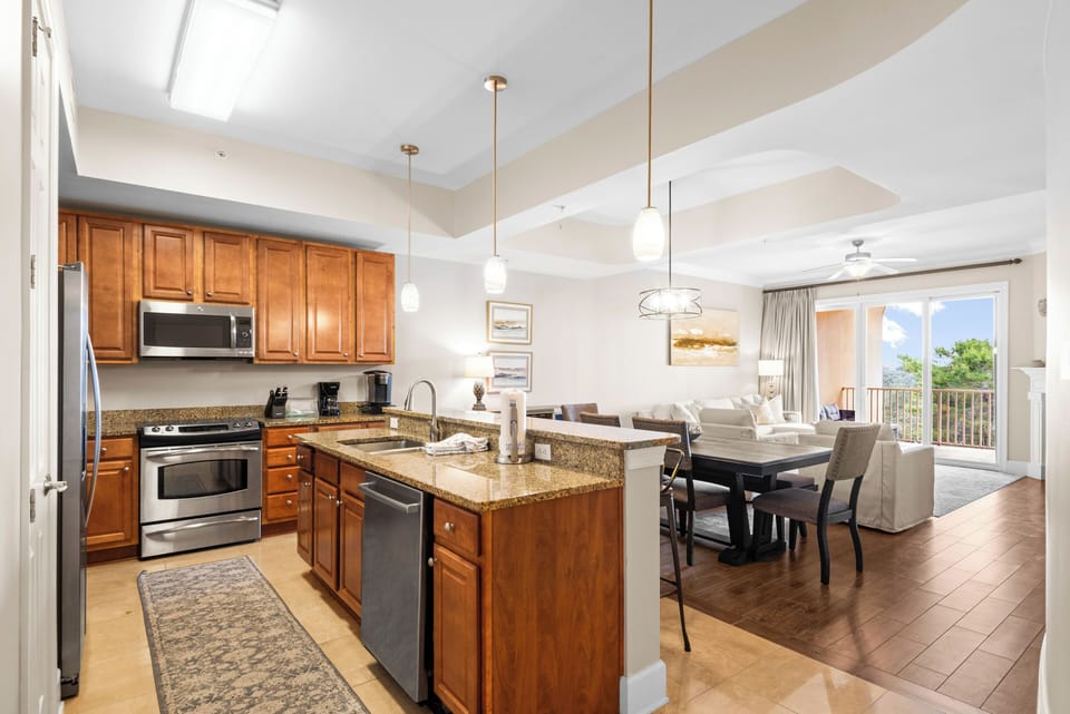 This spacious open-concept kitchen flows seamlessly into the dining and living areas, perfect for entertaining.