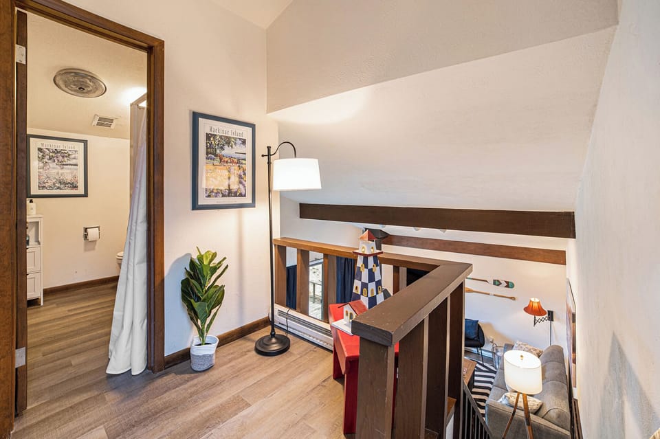 Downstairs bedroom with a queen, bed, plenty of closet space and sitting area.