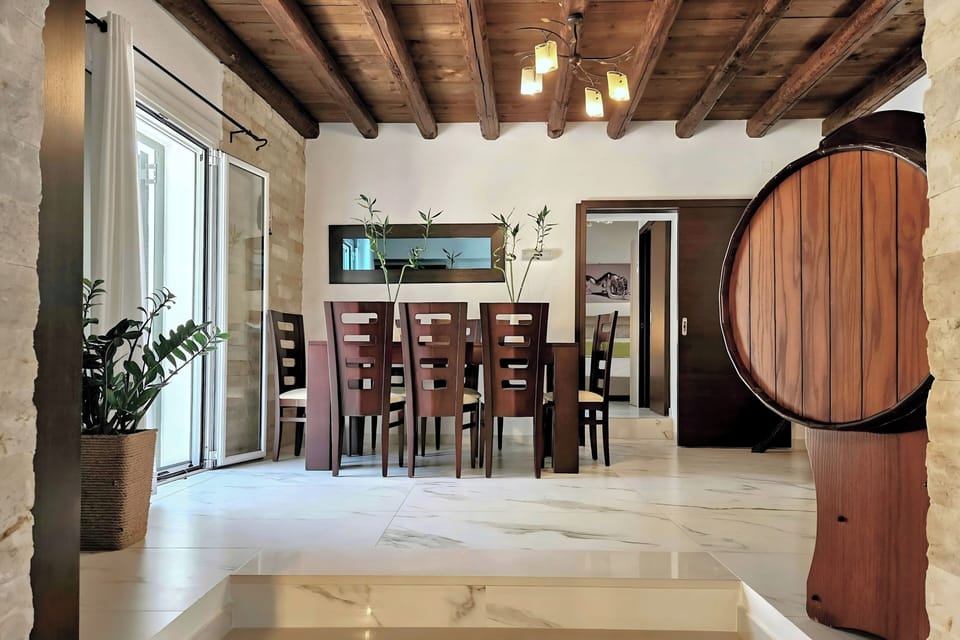 Mezzanine dining area with traditional beams and open interior feel