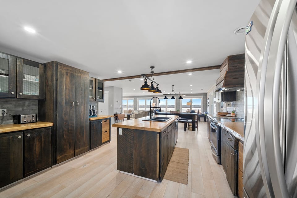 A beautiful kitchen warmly welcomes you into the beach house.