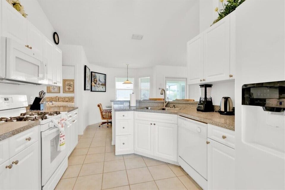 KITCHEN:  Side-by-Side Refrigerator, Microwave, Gas Stove, Oven and Dishwasher