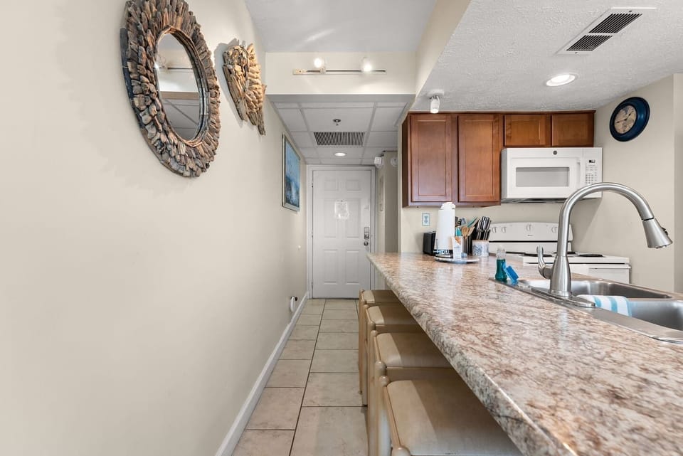 Breakfast bar with seating for four—perfect for quick meals before hitting the beach.