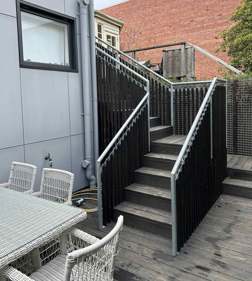 Private entrance through the back garden with stairs leading to the front door.