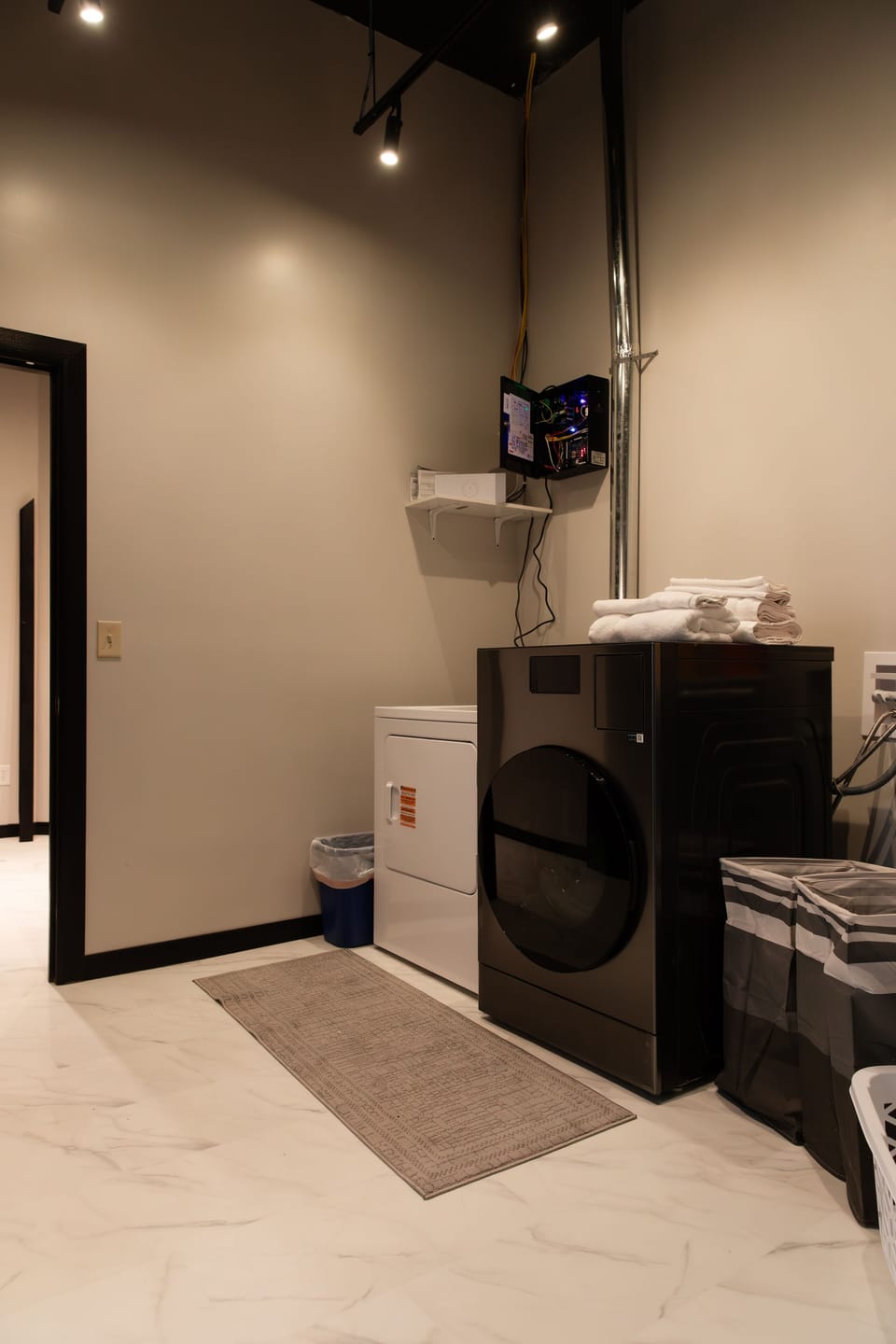 Laundry room. Washing machine and dryer on one. Extra dryer