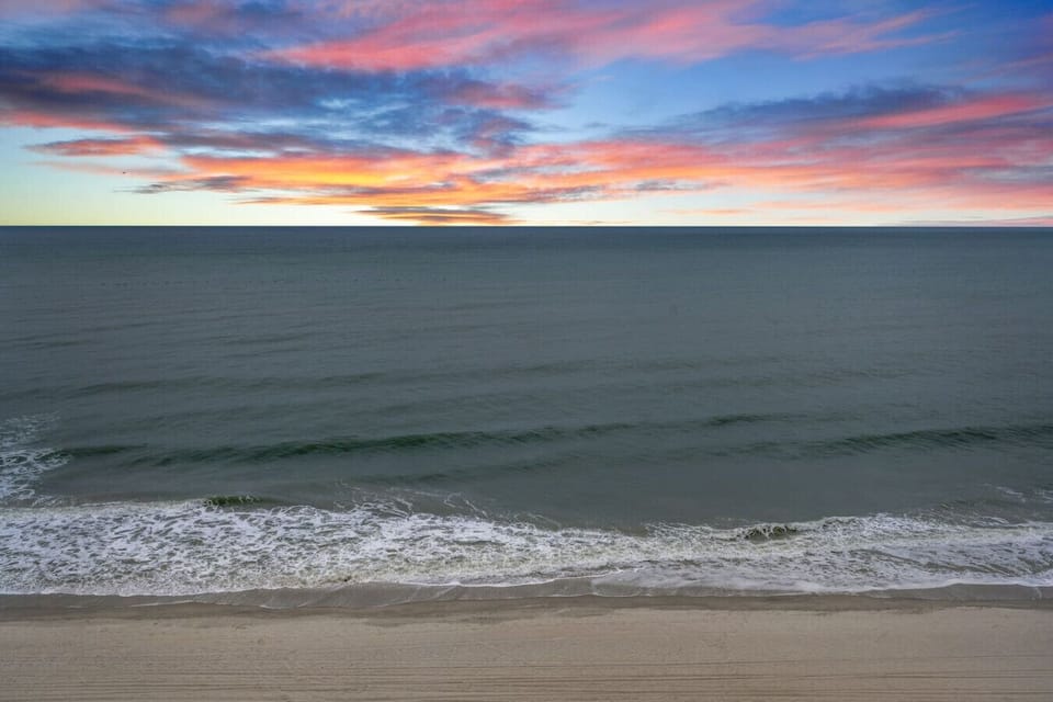 Stunning sunrise views from the balcony; perfect for enjoying your morning coffee while watching the sky glow over the Myrtle Beach shoreline. A peaceful start to every vacation day.