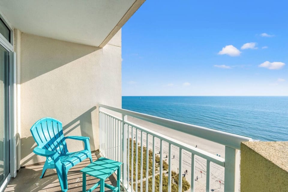 Oceanfront balcony with stunning North Myrtle Beach sunrise views. A perfect spot for morning coffee, relaxing ocean breezes, and peaceful moments overlooking the shoreline. Covered balcony allows enjoyment rain or shine.