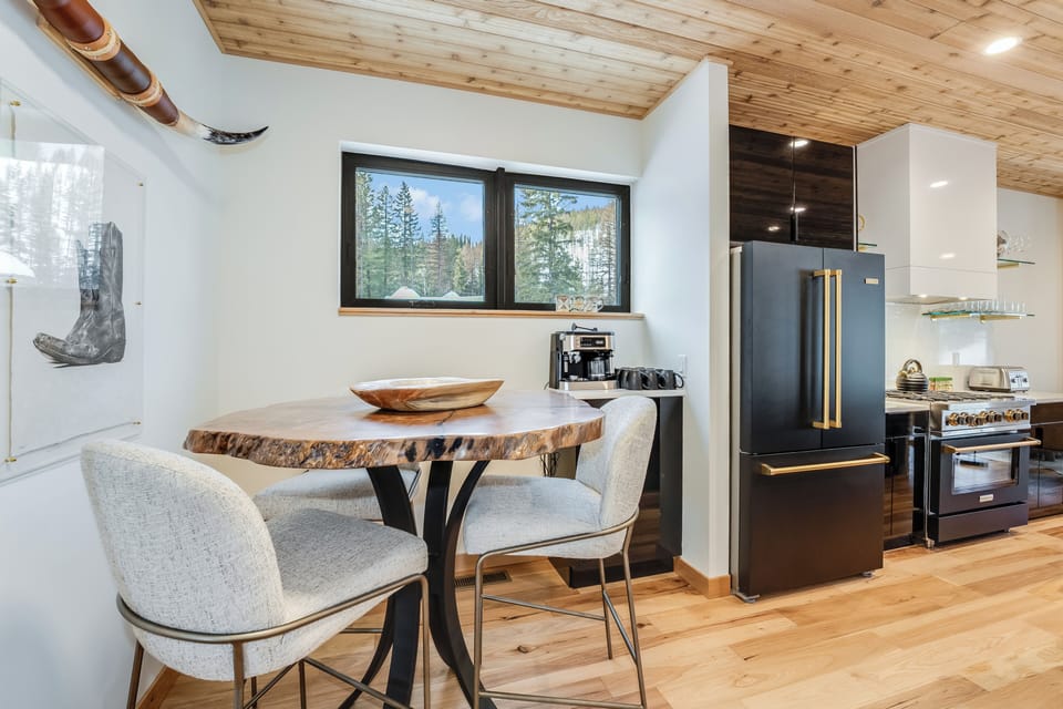 Seating for 3, and a coffee bar. | Main Level