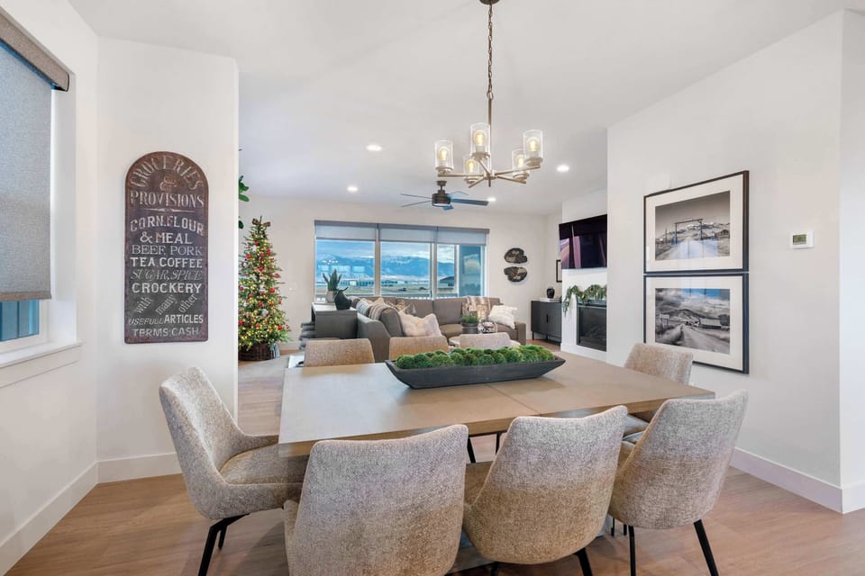 Dining Area: Dine with a backdrop. Gather for meals in this sleek, modern dining space where the majestic Bridger Mountains are the star of the show. Perfect for a memorable short break.