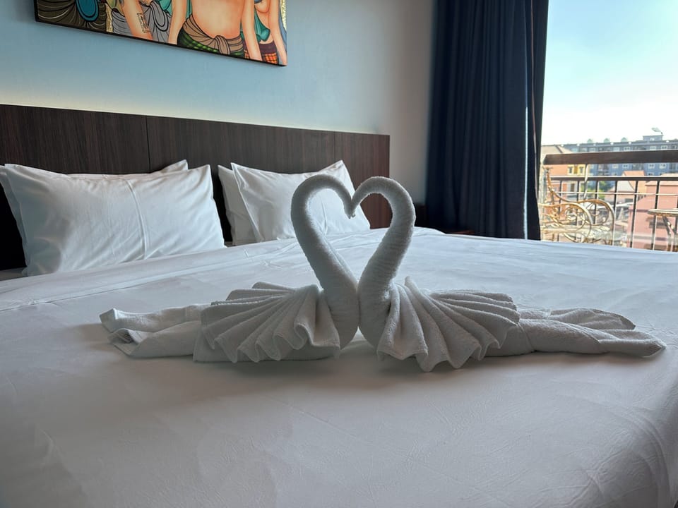 Superior Studio Suite, City View | Free minibar, desk, laptop workspace, bed sheets