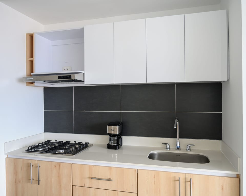 For simplicity and ease of use, the kitchen does not include an oven, dishwasher