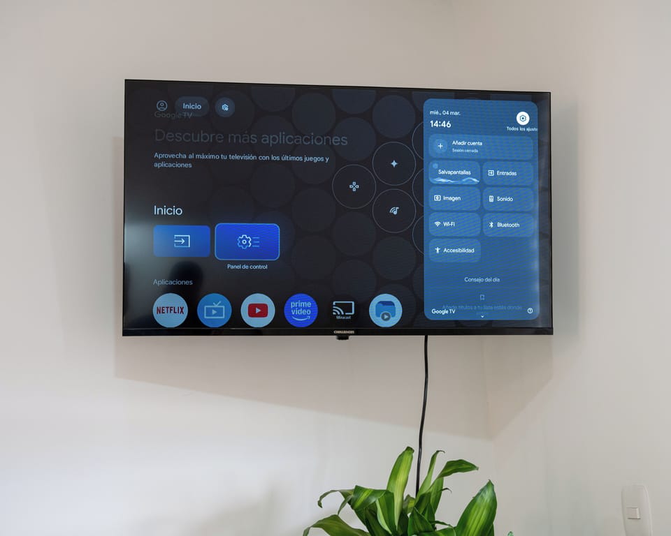 Smart TV mounted on the wall and blackout curtain for movie nights option 